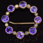 Edwardian 9ct gold brooch set with round cut amethysts and seed pearls, 5g, 3.2cm