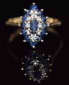 A 9ct gold ring set with diamonds and sapphires in a marquise shaped setting, 2.8g, size K/L