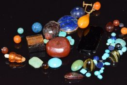 A collection of turquoise cabochons, lapis lazuli cabochon amber earring, etc