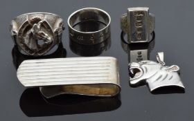 A silver ingot ring, white metal ring in the form of a horseshoe and horse, silver money clip,