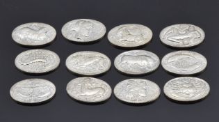 Set of twelve Zodiac sign white metal cuff link inserts, from the Ian Rank-Broadley collection, 39g