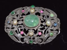A continental silver brooch set with emerald cabochon, ruby cabochons and sapphires and four pearls,