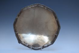 George V hallmarked silver salver with shaped gadrooned edge, raised on four feet, Sheffield 1918,