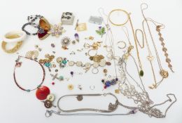 A collection of costume jewellery including necklaces, brooches, etc