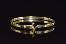 Tiffany & Co 18ct gold hook and eye bangle, 18.3g