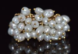 A 9ct gold multi band ring with a cluster of beaded pearls, 9.3g, size N