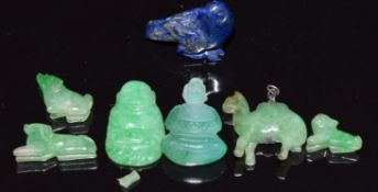 Three jade carvings of dogs, jade carving of a Buddha, a carved lapis lazuli bird, etc