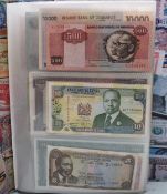 A collection of world banknotes contained in an album, mostly clean examples to include an