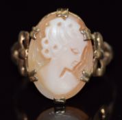 A 9ct gold ring set with a cameo with bow decoration to the shoulders, 2.7g, size N