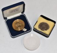 Prince of Wales 60th Birthday crown, Royal Mint brass prototype, a rubber proof and a cupro-nickel