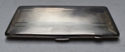 George V hallmarked silver cigarette case with engine turned decoration, pre war car interest