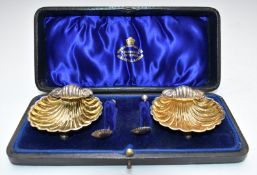 Victorian cased pair of hallmarked silver shell shaped salts with spoons, Birmingham 1896, maker