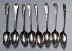 Eight Georgian Irish hallmarked silver dessert spoons with bright cut decoration, three Dublin circa