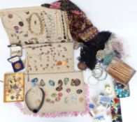 A collection of costume jewellery including beads, enamel copper pendants, large silver necklace,