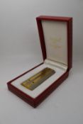 Cartier silver and gold plated lighter with screwed on panel decoration, in original Must de Cartier