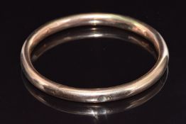 A 9ct rose gold flapper bangle, 10.3g