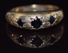 A 9ct gold ring set with sapphires in star settings, 3.7g, size M