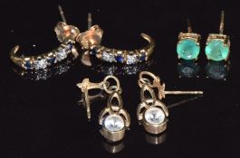 A pair of 9ct gold earrings set with an emerald to each, a pair of 9ct gold earrings set with
