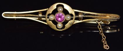 A 9ct gold brooch set with a tourmaline and seed pearls, 2.9g, 4.5cm long