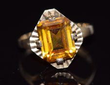 A 9ct gold ring set with an emerald cut citrine, 3.5g, size N