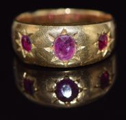 Victorian yellow metal ring set with three rubies in star settings (5g), in Saqui & Lawrence ring