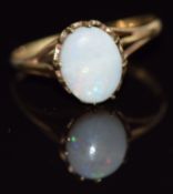 A 9ct gold ring set with an opal cabochon, 1.7g, size O