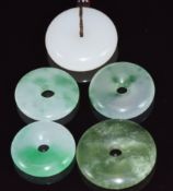 Five jadeite bi-disc, largest 2.9cm