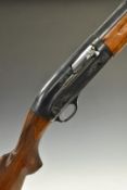 Baikal 12 bore three shot semi-automatic shotgun with engraved lock, chequered semi-pistol grip