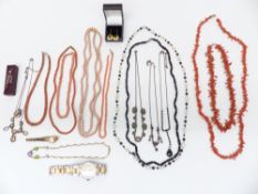 Six coral necklaces, one with a gold clasp, pearl and oynx necklace, three silver necklaces, pearl