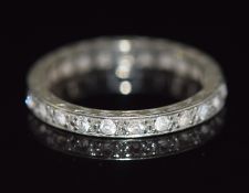 A 9ct white gold eternity ring set with paste, 2.1g, size L/M