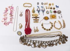 A collection of costume jewellery including silver brooch, silver ring set with a white sapphire,