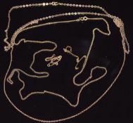 Two 9ct gold necklaces and a section of yellow metal chain, 7.4g