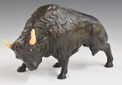 Bronze study of a bison with ceramic horns, L28cm