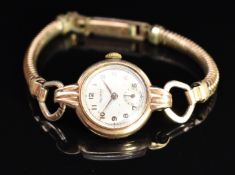 Rotary 9ct gold ladies wristwatch with subsidiary seconds dial, gold hands and Arabic numerals,