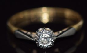 An 18ct gold ring set with a diamond in a platinum setting, 2g, size L/M
