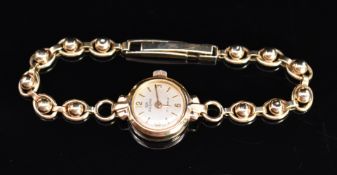 Audax 9ct gold ladies wristwatch with gold hands and hour markers, silver dial and mechanical