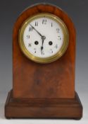 A c1900 mahogany carved arch top mantel clock, the anonymous two train movement stamped 3000, 52,