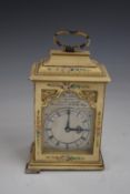 An early 20thC miniature faux lacquer cased clock, the silver dial inscribed Chas Frodsham, London