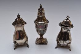 Pair of hallmarked silver peppers, Birmingham 1924, maker's mark rubbed together with a further