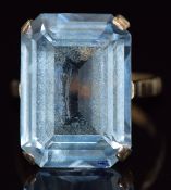A 9ct gold ring set with an emerald cut aquamarine, 6.1g, size K