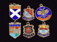 Six 9ct gold enamel charms including 'Bristol', 'Weston Super Mare', 'Scotland', 'Falmouth', 'St