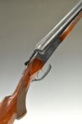Baikal IJ-58-M 12 bore side by side shotgun with heavy engraving of dogs to the locks, chequered