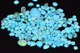 A collection of loose turquoise cabochons including heart cut examples, 15g