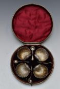 Cased Victorian set of four hallmarked silver shell shaped salts, Birmingham 1875, maker's mark