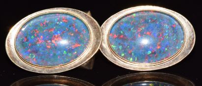 A pair of 9ct gold cufflinks set with black opal doublets, 12g