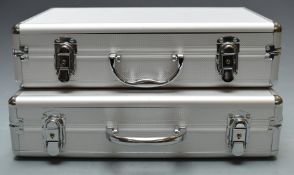 Two aluminum coin collector's cases