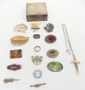 A collection of brooches including two silver, one by OMG, Victorian brooch, etc