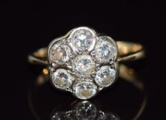An 18ct gold ring set with diamonds in a cluster, total diamond weight approximately 1.05ct, 3.2g,