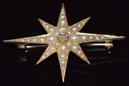 Edwardian star brooch set with a central old cut diamonds and seed pearls, 4 x 3cm, 3.2g