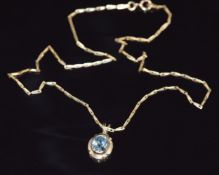 A 9ct gold pendant set with an oval cut aquamarine, on 9ct gold chain, 4g